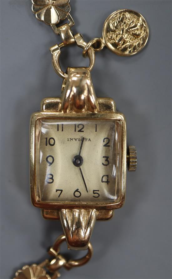 A ladys 9ct gold wristwatch with fancy flower-link bracelet and miniature St Christopher medallion, gross approx 14.8g.
